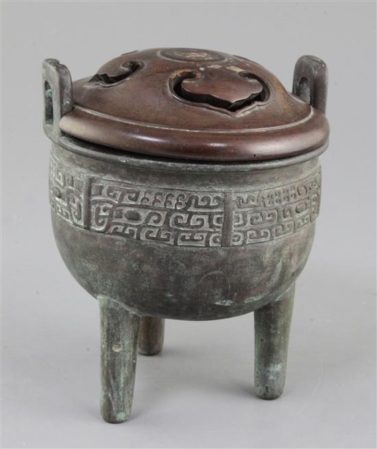 A Chinese archaic bronze tripod ritual food vessel, Ding, Qing dynasty., 17cm high, 14cm wide